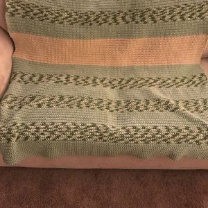 Hand made soft loveseat size Afghan. Made of 100%.
